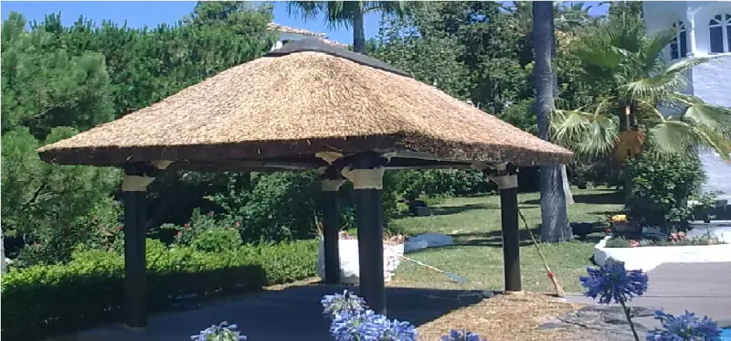 African thatch pergola in a garden