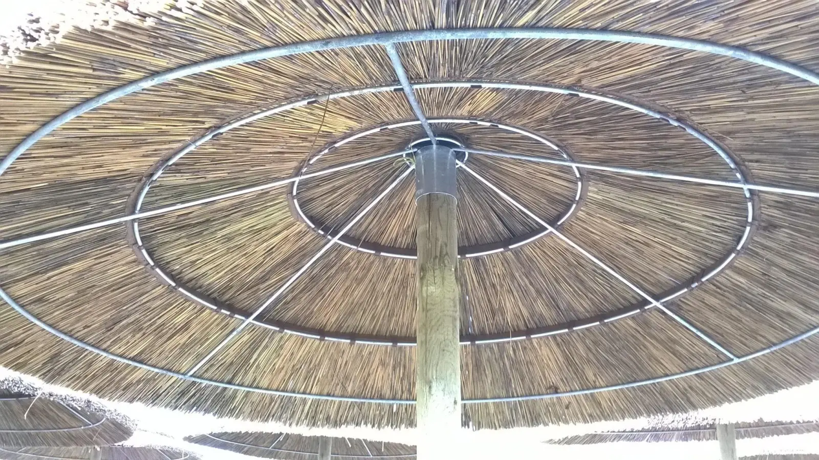 Inside an African thatch tile umbrella